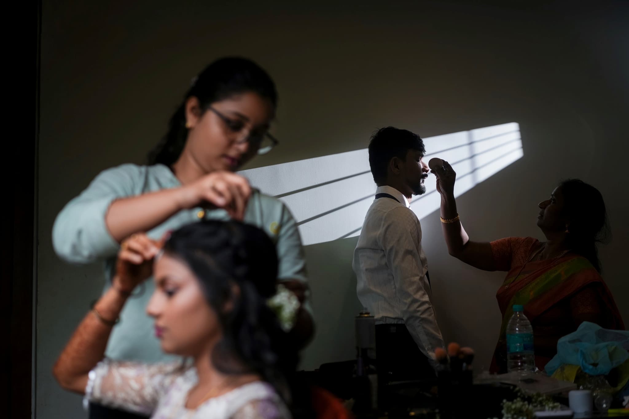 Cinematic Wedding Videography - Behind the scenes preparation with dramatic lighting