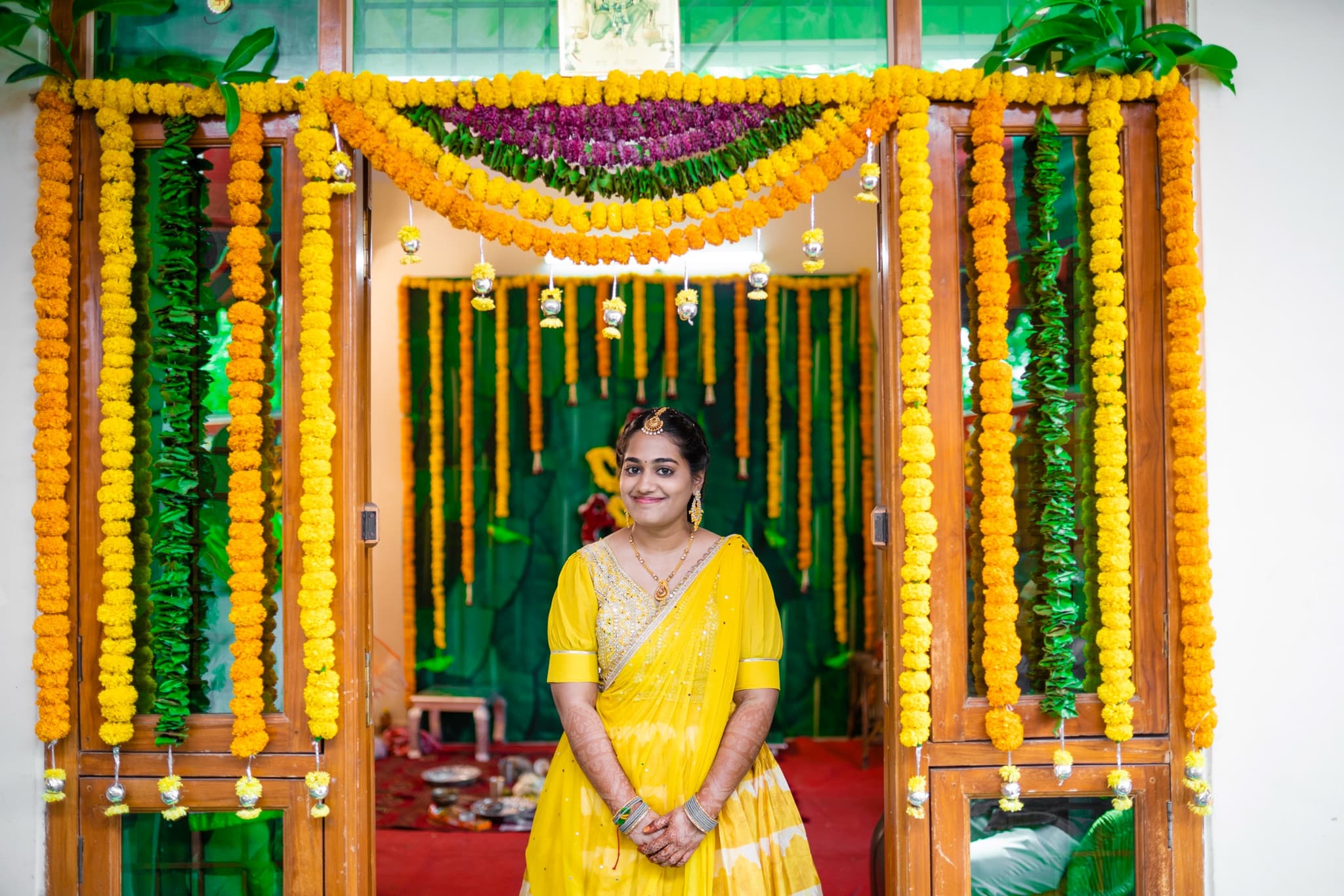 Traditional South Indian wedding decoration with marigold garlands
